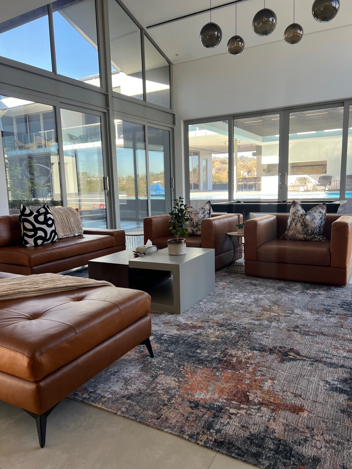 Tan leather lounge suite with bespoke coffee table